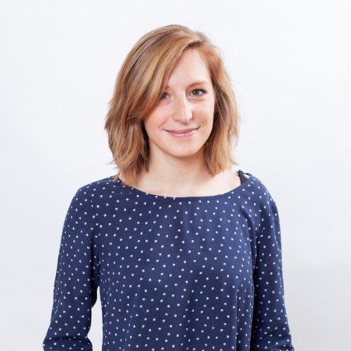 Corporate headshot of a woman smiling at the camera.